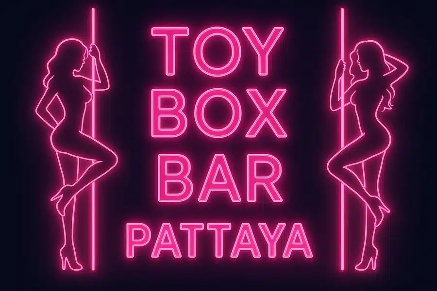 Neon-Schild der Toy Box Bar Pattaya mit zwei Tänzerinnen an der Stange – symbolhaftes Motiv für Nachtleben in Soi 6.